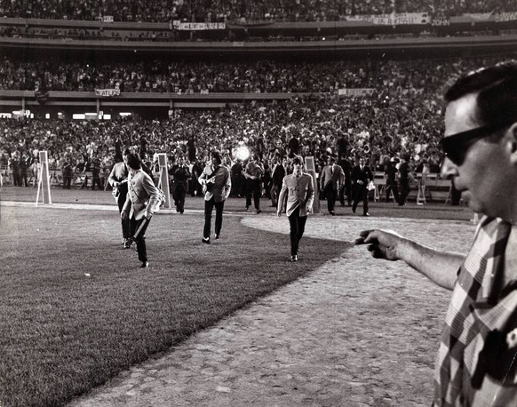 Feb. 22, 1964 - New York, NY, U.S. - The Beatles: JOHN LENNON, GEORGE HARRISON, RINGO STARR, PAUL MCCARTNEY at Shea Stadium before 60,000 fans. February 2004 marks the 40th Anniversary of Beatlemania  ...