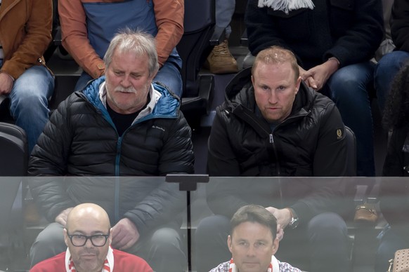 Ludovic Magnin, right, coach of FC Lausanne-Sport, sitting next to his father Jean-Claude Magnin, left, looks the game, during the seventh leg of the National League Swiss Championship quarter final p ...