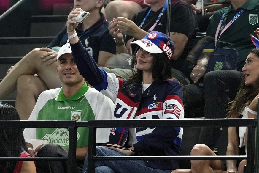 Kendall Jenner takes a selfie during the women's artistic gymnastics all-around finals in Bercy Arena at the 2024 Summer Olympics, Thursday, Aug. 1, 2024, in Paris, France. (AP Photo/Abbie Parr)