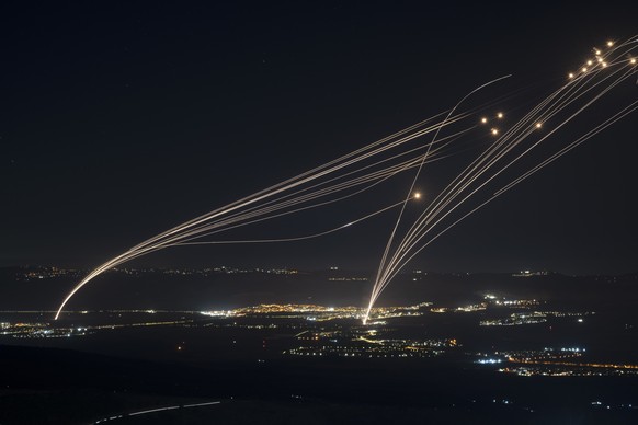 The Israeli Iron Dome air defense system fires to intercept an attack from Lebanon over the Galilee region as seen from the Israeli-annexed Golan Heights, on Aug. 4, 2024. (AP Photo/Leo Correa)