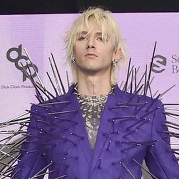 Machine Gun Kelly arrives at the American Music Awards on Sunday, Nov. 20, 2022, at the Microsoft Theater in Los Angeles. (Photo by Jordan Strauss/Invision/AP)