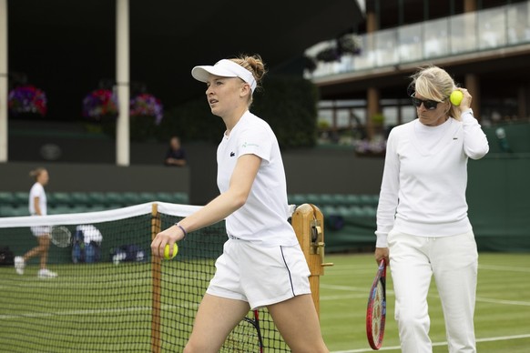 Celine Naef of Switzerland with her mother and coach Sandra Huber Naef during a training session the All England Lawn Tennis Championships in Wimbledon, London, Saturday, July 1, 2023. The Wimbledon T ...