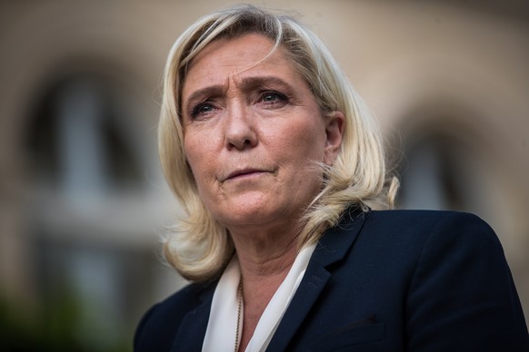 epa10026011 French far-right Rassemblement National (RN) leader and Member of Parliament Marine Le Pen speaks to the media after a meeting with French President Macron, at the Elysee Palace in Paris,  ...