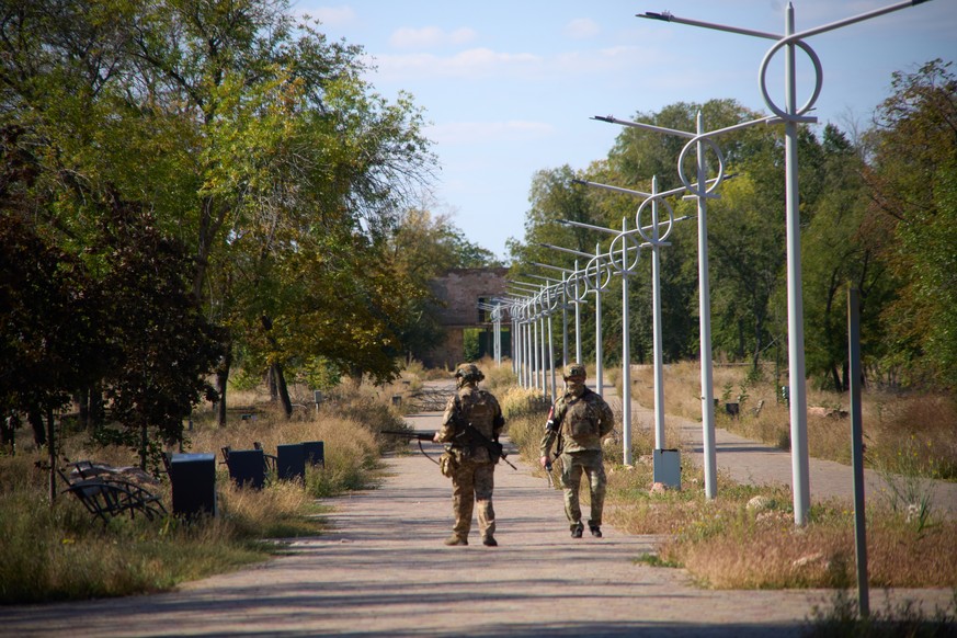 Two Russian Army soldiers patrol an area in the center of the Russia-controlled city of Kurakhove, Donetsk region, Ukraine, Saturday, Sept. 27, 2025. (AP Photo)
Russia Ukraine