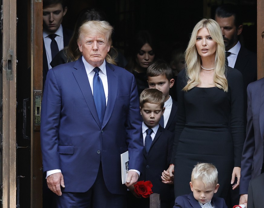 epa10082903 Former US President Donald and his daughter Ivanka and her children stand behind the coffin with the remains of his former wife Ivana Trump at St. Vincent Ferrer Roman Catholic Church in N ...