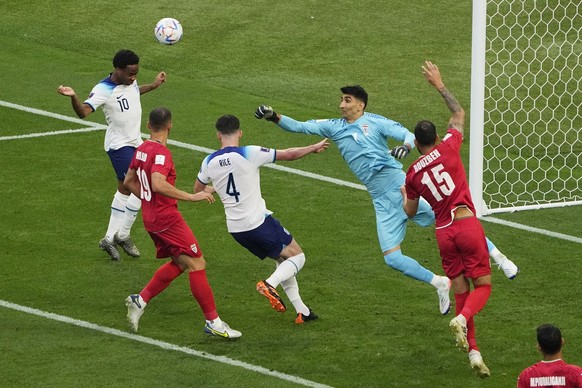 Iran&#039;s goalkeeper Alireza Beiranvand, second from right, clears the ball before colliding with Iran&#039;s Majid Hosseini, second from left, the World Cup group B soccer match between England and ...