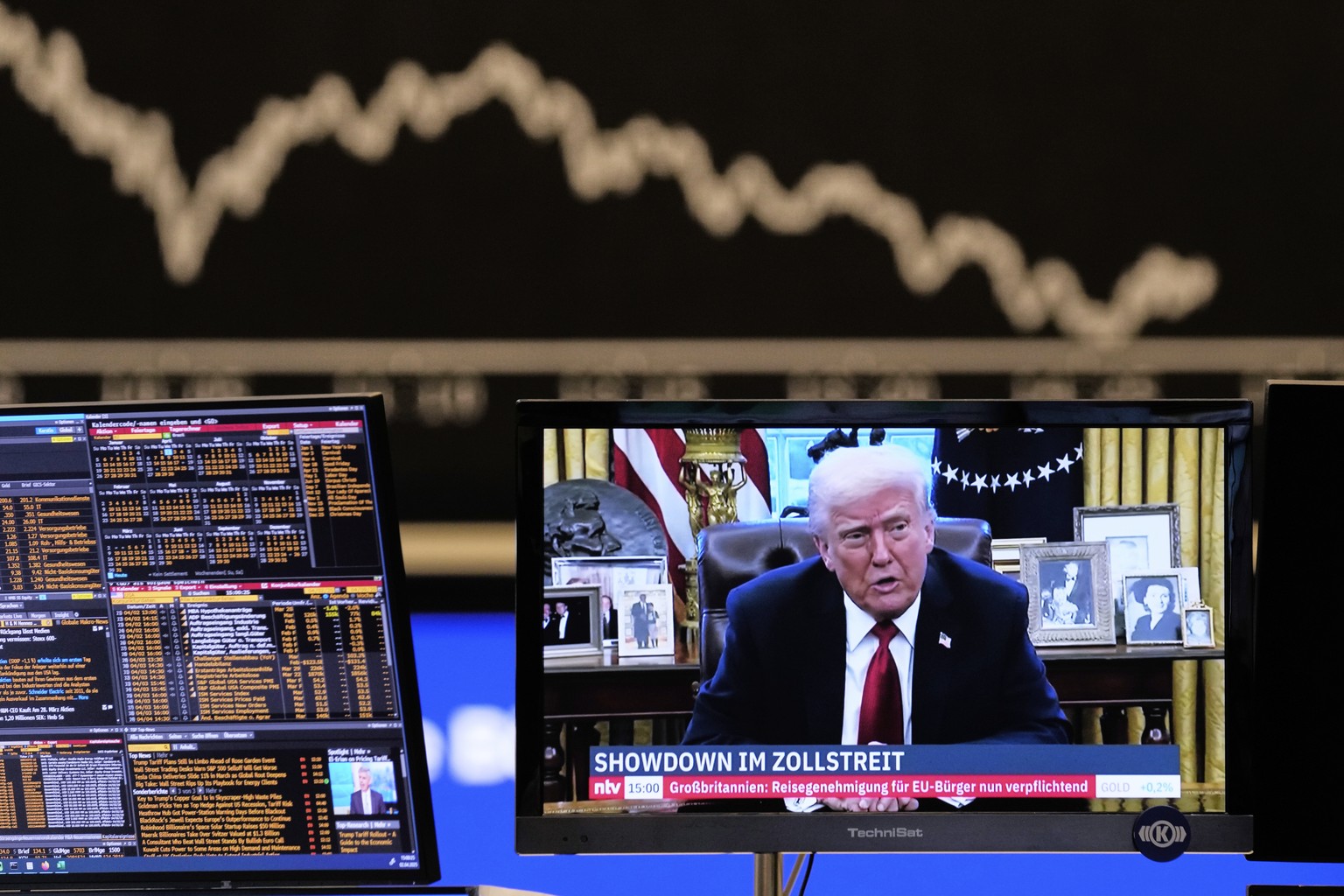 Us President Donald Trump appears on a television screen at the stock market in Frankfurt, Germany, Wednesday, April 2, 2025. (AP Photo/Michael Probst)
Germany Stock Market