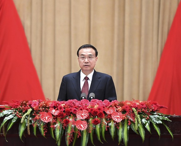 In this photo released by China&#039;s Xinhua News Agency, Chinese Premier Li Keqiang speaks at a reception to commemorate the anniversary of the founding of the People&#039;s Republic of China at the ...