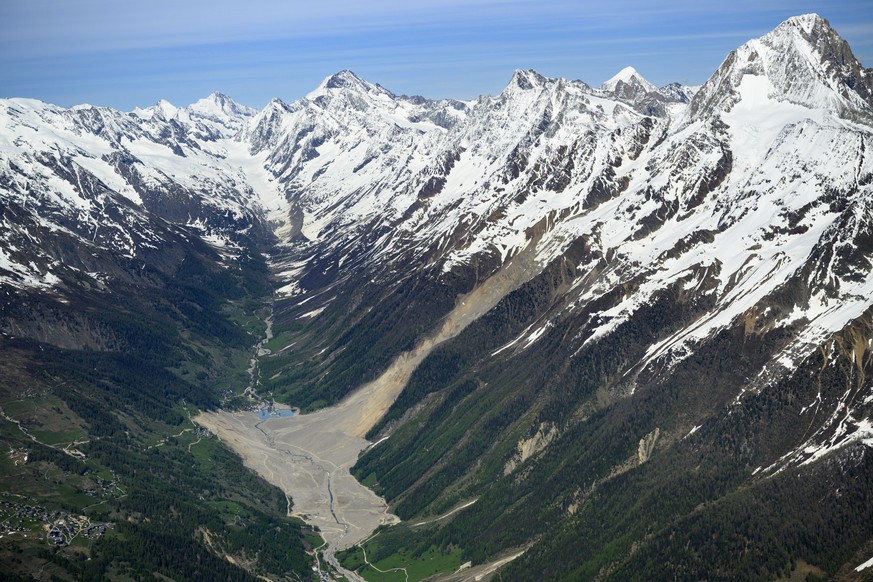 The massive landslide and debris field caused by the collapse of the Birch Glacier, which unleashed tons of rock and ice into the Loetschental valley pictured 1 year after the landslide destroyed the  ...