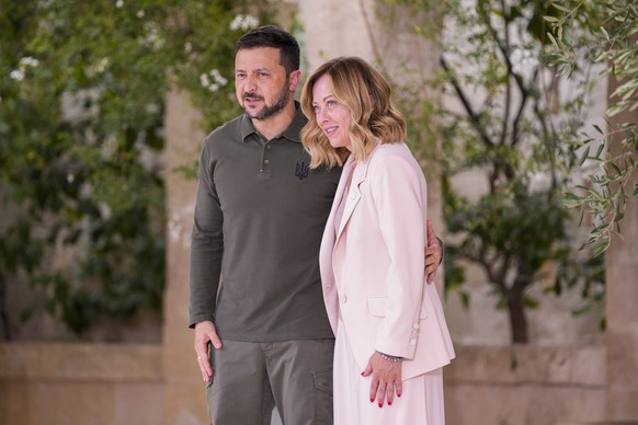 Ukraine's President Volodymyr Zelenskyy, left, is welcomed by Italian Prime Minister Giorgia Meloni during a G7 world leaders summit at Borgo Egnazia, Italy, Thursday, June 13, 2024. (AP Photo/Do ...