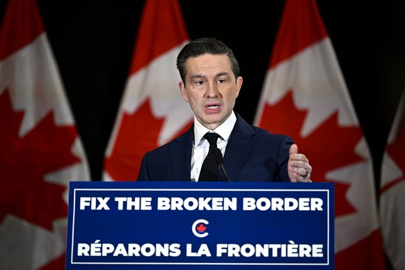 Canada Conservative Leader Pierre Poilievre holds a news conference in a hotel ballroom in Ottawa, on Sunday, Dec. 1, 2024. (Justin Tang/The Canadian Press via AP)
