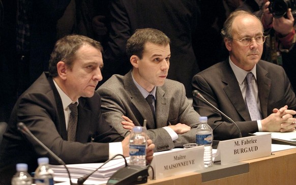 (FILES) In this file photo taken on February 8, 2006 French judge Fabrice Burgaud (C), 34, the magistrate at the centre of one of France&#039;s biggest judicial fiascos, speaks next to his lawyers Pat ...