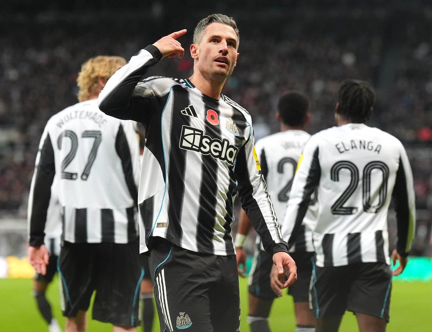 Newcastle United's Fabian Schar celebrates scoring during the English League Cup fourth round soccer match between Newcastle United and Tottenham Hotspur in Newcastle, England, Wednesday Oct. 29, ...