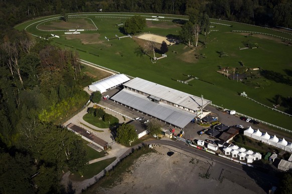 epa13204170 An aerial view shows the Schachen horse racing track in Aarau, Switzerland, 01 September 2026. Tributes were laid at the site following a 30 August shooting during an electronic music fest ...