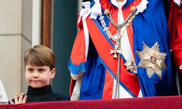 LONDON, ENGLAND - MAY 06: Catherine, Princess of Wales, Prince Louis of Wales and Prince William, Prince of Wales on the balcony of Buckingham Palace following the Coronation of King Charles III and Q ...