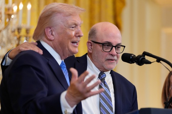 Mark Levin listens as President Donald Trump speaks during a Hanukkah reception in the East Room of the White House, Tuesday, Dec. 16, 2025, in Washington. (AP Photo/Alex Brandon)
Donald Trump