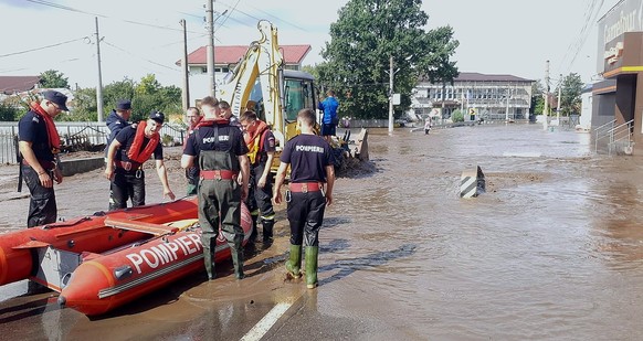 epa11603981 A handout photo made available by the Romanian General Inspectorate for Emergency Situations (IGSU) shows Romanian rescuers preparing their gear for operations in the flood-affected villag ...