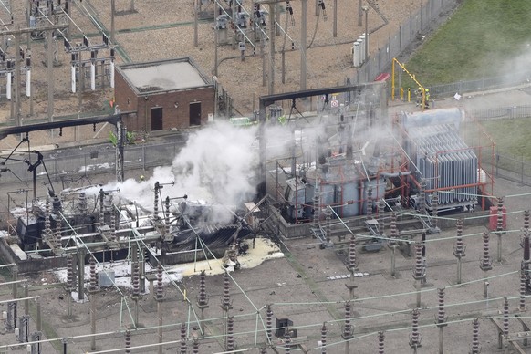 Smoke rises from the North Hyde electrical substation, which caught fire last night, leading to the closure of the Heathrow Airport, in London, Friday March 21, 2025. (Jonathan Brady/PA via AP)
Britai ...