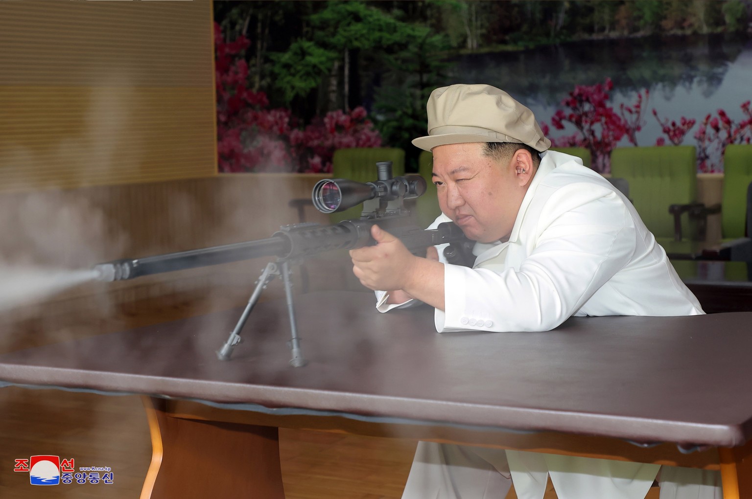 epa10787051 An undated photo released by the official North Korean Central News Agency (KCNA) on 06 August 2023 shows North Korean leader Kim Jong Un trying a weapon during an inspection of major muni ...