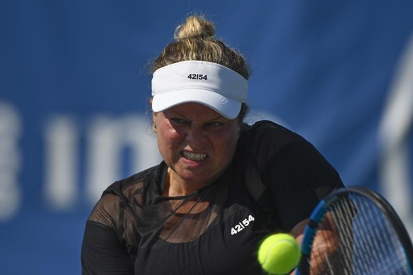 Kim Clijsters, of Belgium, hits a backhand against Su-Wei Hsieh, of Taiwan during her first round match in the Chicago Fall Tennis Classic tournament, Monday, Sept. 27, 2021, in Chicago. (AP Photo/Mat ...