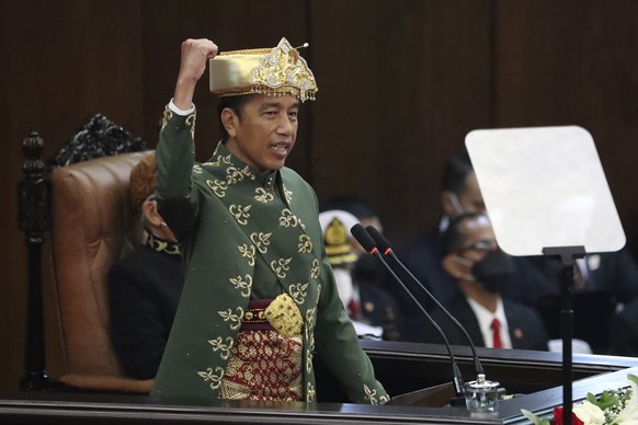 Indonesian President Joko Widodo gestures as he delivers his annual State of the Nation Address ahead of the country&#039;s Independence Day, at the parliament building in Jakarta, Indonesia, Tuesday, ...