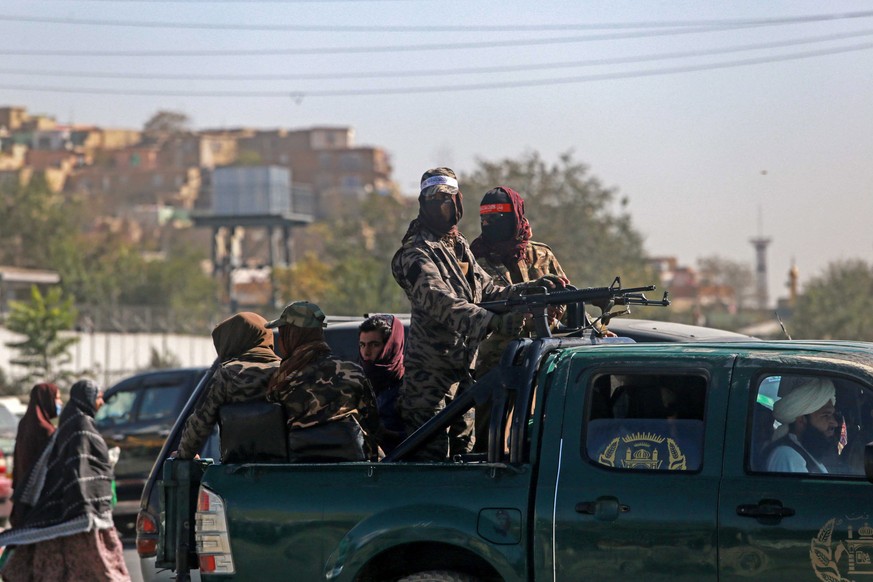 epa10058147 Taliban stand guard near the scene of an operation against the IS militants in Kabul, Afghanistan, 07 July 2022. Zabihullah Mujahid, spokesman for the Islamic Emirate of Afghanistan, said  ...