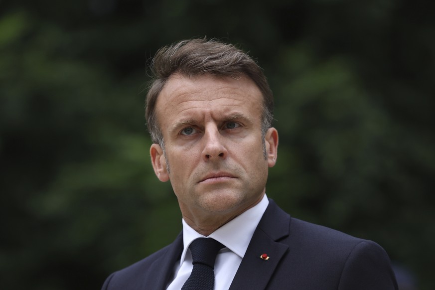 FILE - French President Emmanuel Macron reviews troops that will take part to the Bastille Day parade in Paris, on July 2, 2024. In his first public declaration since Sunday&#039;s legislative electio ...