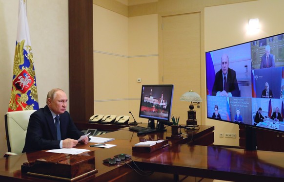 Russian President Vladimir Putin chairs a meeting on economic issues via videoconference at the Novo-Ogaryovo residence outside Moscow, Russia, Monday, April 18, 2022. (Mikhail Klimentyev, Sputnik, Kr ...