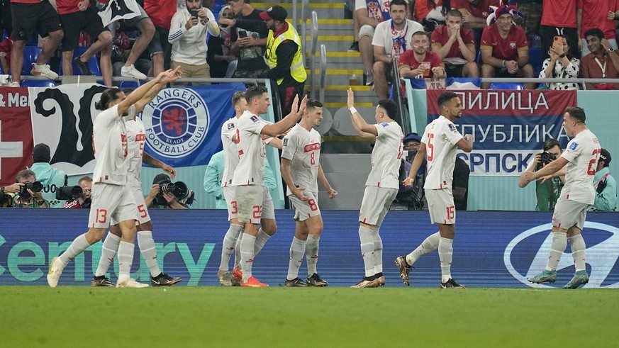 Switzerland&#039;s Remo Freuler, center, celebrates with teammates after scoring his side&#039;s third goal during the World Cup group G soccer match between Serbia and Switzerland, at the Stadium 974 ...