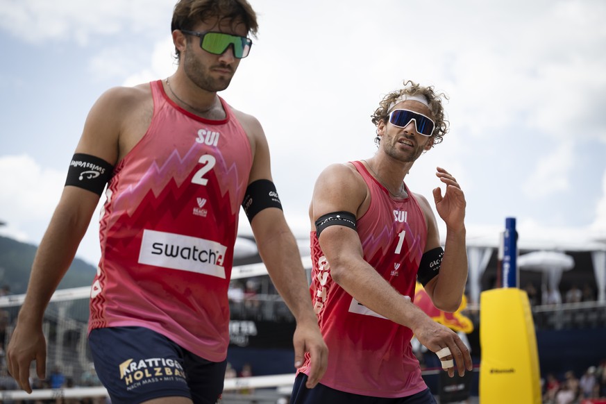 Switzerland&#039;s Leo Dillier, left, and Switzerland&#039;s Marco Krattiger, right, react during their match against Brazil&#039;s Evandro Gon