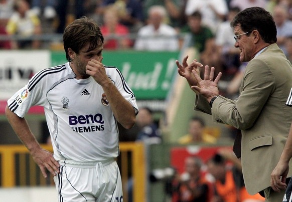 Real Madrid&#039;s coach Italian Fabio Capello (R) gives instructions to forward Antonio Cassano during their Spanish First Division League against Levante, at Ciudad de Valencia stadium, in Valencia, ...