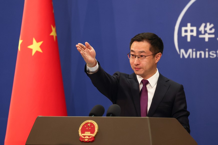 epa12628184 China's Foreign Ministry spokesperson Lin Jian gestures during a press conference at the Ministry of Foreign Affairs in Beijing, China, 05 January 2026. China reiterated Beijing' ...