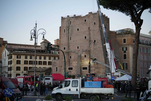 Firefighters work on a medieval tower Torre dei Conti near the Roman Forum after it had partially collapsed during renovation works, meters away from the Colosseum in Rome, Monday, Nov. 3, 2025. (AP P ...