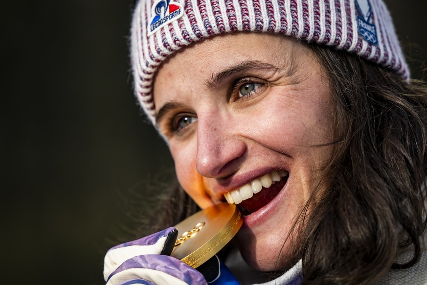 Gold medalist Julia Simon of France poses during the medals ceremony of the women's Biathlon 15km Individual competition at the 2026 Olympic Winter Games in Anterselva, Italy, on Wednesday, Febru ...