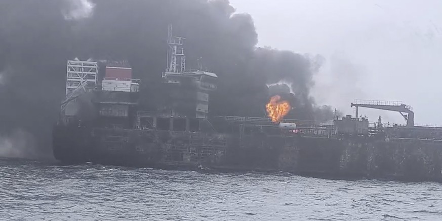 In this image taken from video provided by Denys Mezentsev, rescue crews work on site after a cargo ship was hit by a tanker carrying jet fuel for the U.S. military off eastern England, Monday, March  ...