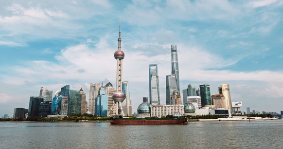 epa12287901 A cargo boat sails on Huangpu River in Shanghai, China, 07 August 2025. Trump on 06 August hinted at new potential tariffs on China, similar to those imposed on India over Russian oil purc ...