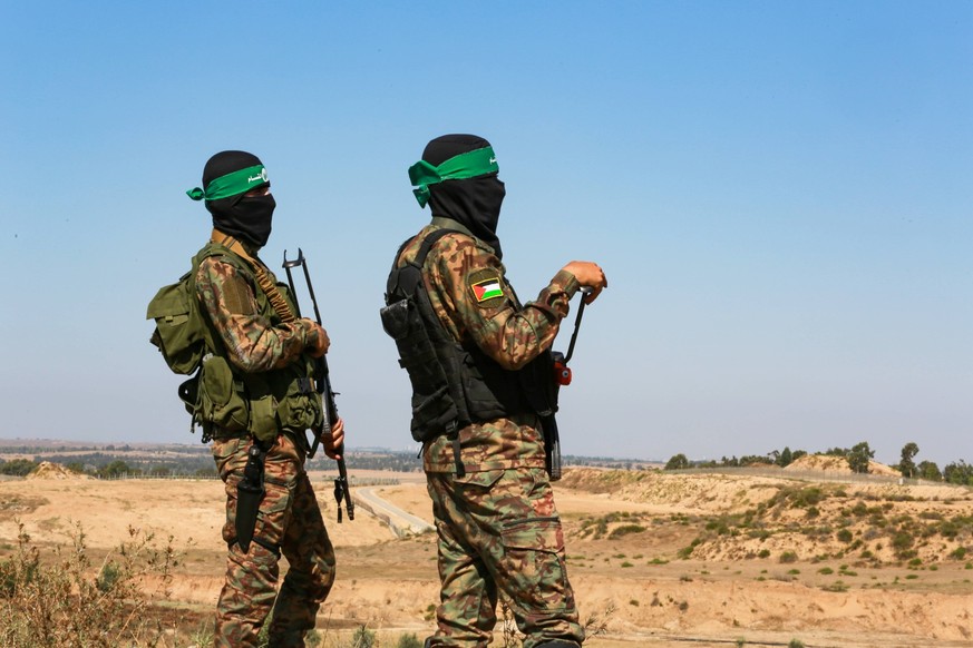 Members of Ezzedine al-Qassam Brigades, the military wing of the Palestinian Hamas movement display weapons which the group used it during the conflict with Israel on 2014 during an exhibition, east o ...