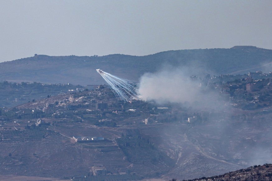 epa11598669 Israeli artillery shells an area of Al-Khiam in southern Lebanon, as seen from the Upper Galilee, northern Israel, 11 September 2024. The Israeli military stated that approximately 30 proj ...