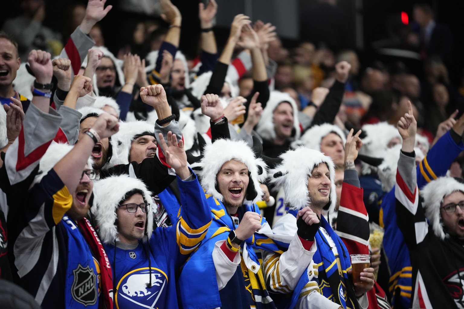 Fans wait for the start of the NHL hockey game between Buffalo Sabres and New Jersey Devils, in Prague, Czech Republic, Friday, Oct. 4, 2024. (AP Photo/Petr David Josek)