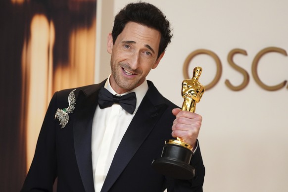 Adrien Brody, winner of the award for best performance by an actor in a leading role for &quot;The Brutalist,&quot; poses in the press room at the Oscars on Sunday, March 2, 2025, at the Dolby Theatre ...