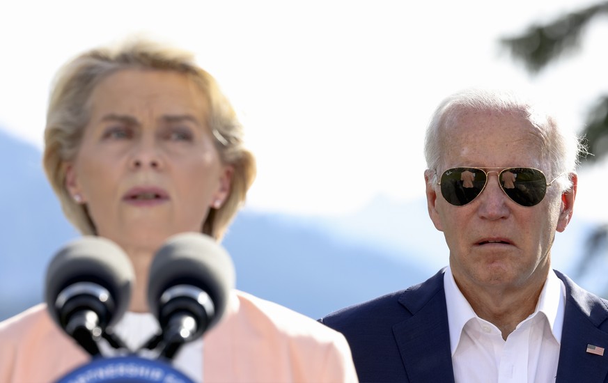 U.S. President Joe Biden stands next to European Commission President Ursula von der Leyen as she speaks during the first day of the G7 leaders&#039; summit at Bavaria&#039;s Schloss Elmau castle, nea ...