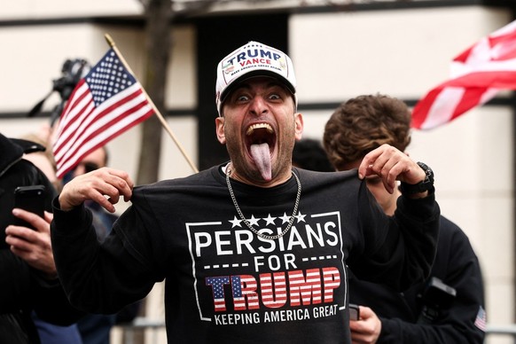 A supporter of far-right influencer Jake Lang (unseen) arrives at a protest Lang organized against alleged "Islamification" and to ask for a "stop of public Muslim prayer" in New Y ...