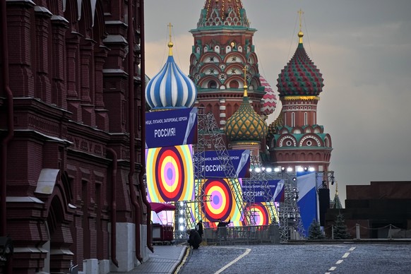 People make preparations for a concert at the Red Square, with constructions reading the words &#039;&#039;Donetsk, Luhansk, Zaporizhzhia, Kherson, Russia&#039;&#039;, and the St. Basil&#039;s Cathedr ...