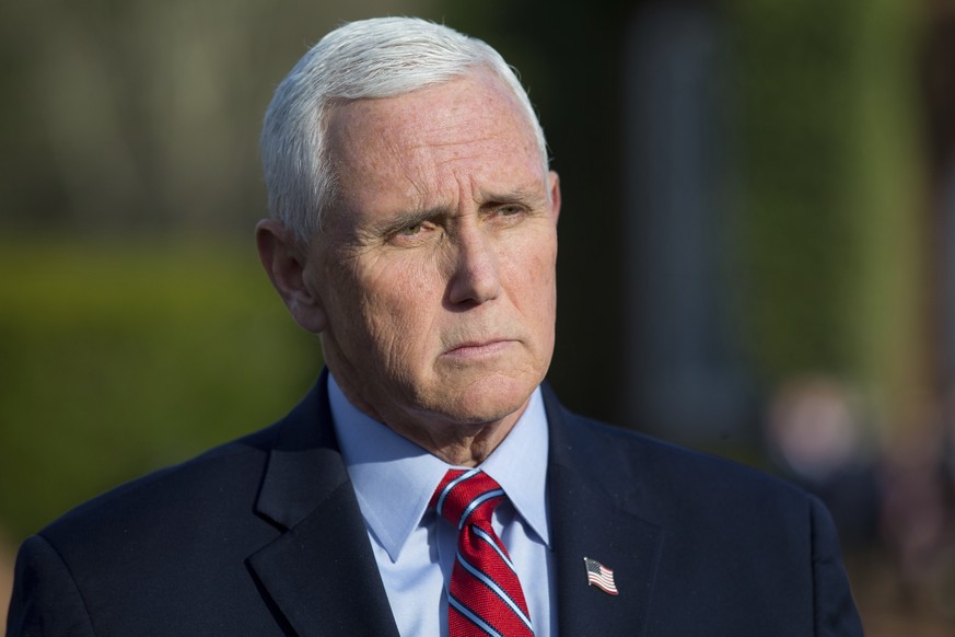 FILE - Former Vice President Mike Pence speaks to reporters before the MockCon event at University Chapel at Washington and Lee University, March 21, 2023, in Lexington, Va. A federal judge has ruled  ...
