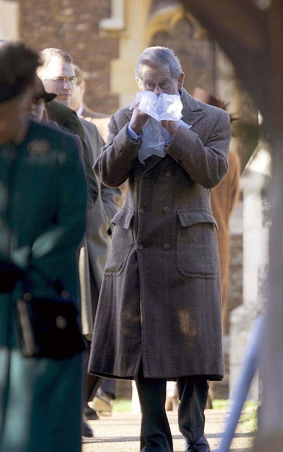 SANDRINGHAM, UNITED KINGDOM - DECEMBER 26: Prince Charles Suffering From A Cold And Blowing His Nose With A Handkerchief After Church At Sandringham On Boxing Day (Photo by Tim Graham Picture Library/ ...