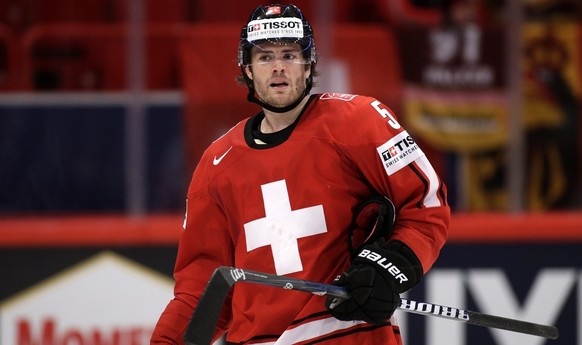 Switzerland&amp;#039;s Severin Blindenbacher looks on his teammates, during the IIHF Ice Hockey World Championships preliminary round game Switzerland vs Denmark at the Globe Arena in Stockholm, Swede ...