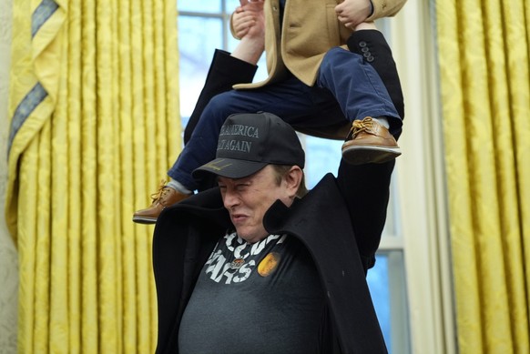 Elon Musk lifts his son X � A-Xii,on his shoulders during an event with President Donald Trump in the Oval Office at the White House, Tuesday, Feb. 11, 2025, in Washington. (Photo/Alex Brandon)