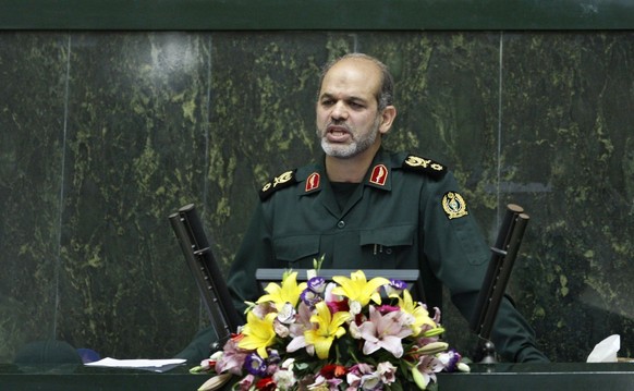 Nominee for defense minister, Gen. Ahmad Vahidi, delivers his speech in an open session of parliament to debate on the qualification of proposed ministers of Iranian President Mahmoud Ahmadinejad, in  ...