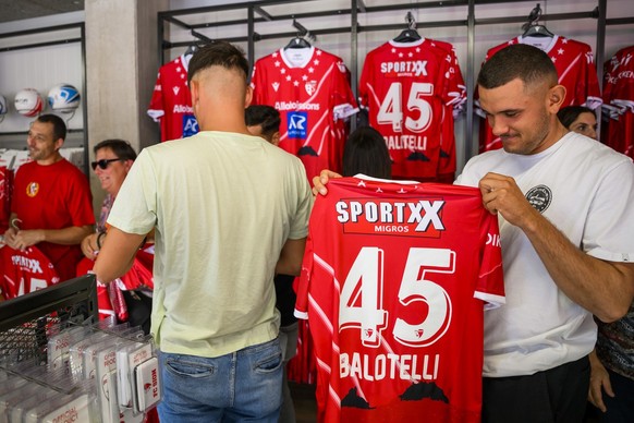 Fans buy jerseys of the new player Sion&#039;s forward Mario Balotelli of Italy in the club&#039;s store during the Super League soccer match of Swiss Championship between FC Sion and FC Basel, at the ...