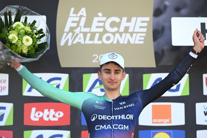 MUR DE HUY, BELGIUM - APRIL 22: Paul Seixas of France and Team Decathlon CMA CGM celebrates at podium as race winner during the 90th La Fleche Wallonne 2026 a 200km one day race from Herstal to Mur de ...